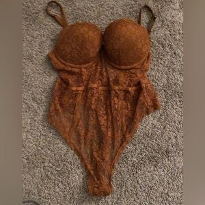 Burnt orange body suit, slightly worn